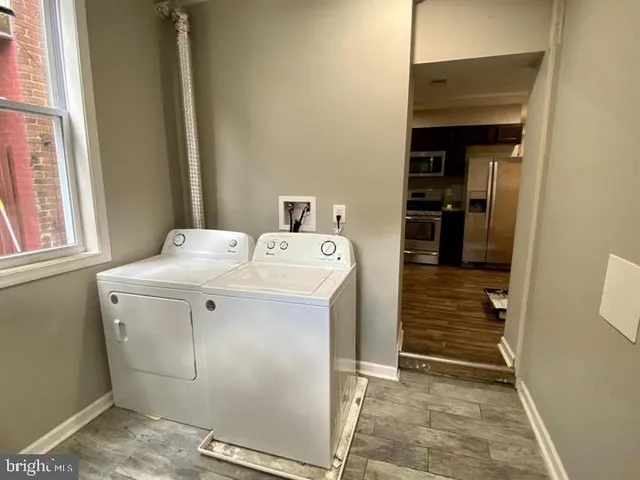 a utility room with dryer and washer