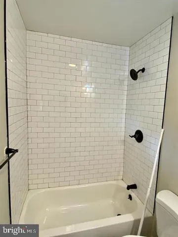 a bathroom with a shower and a bathtub
