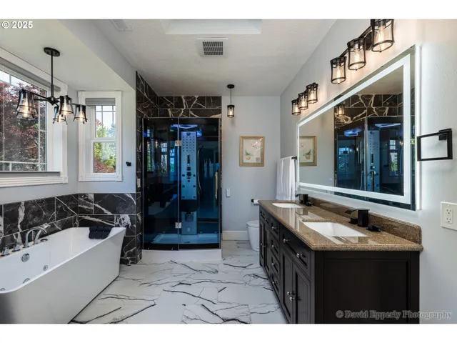 a bathroom with a sink a mirror and a bathtub