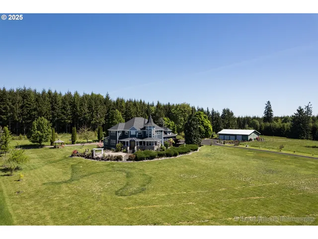 a view of a swimming pool with lawn chairs and couches