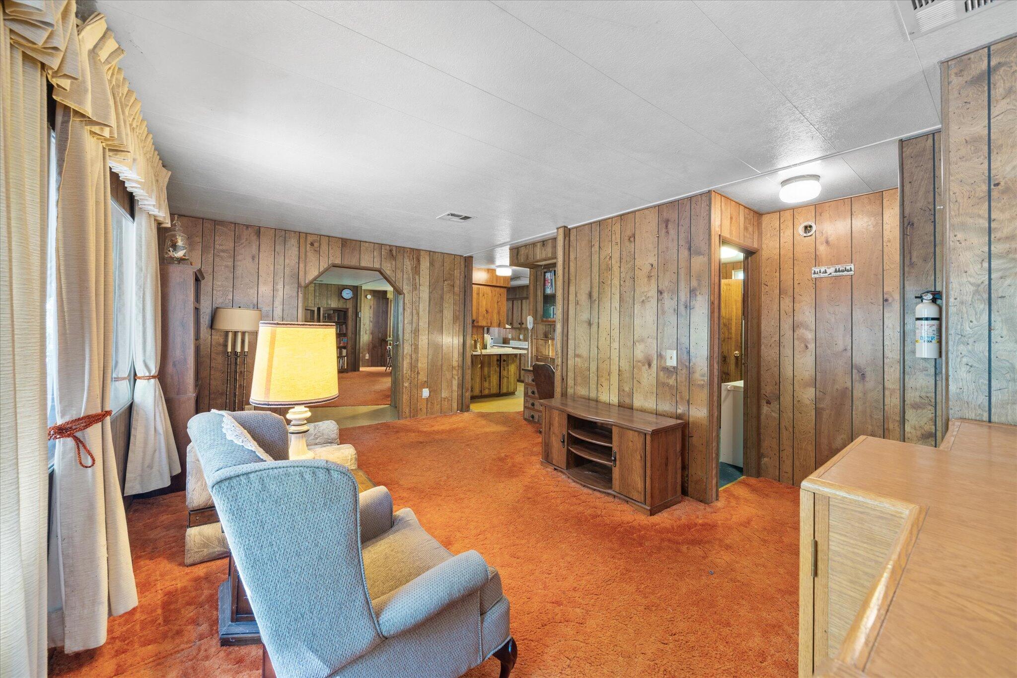 30588 Shingletown Ridge Road Shingletown, CA 96088 - Photo 14 of 44 a living room with furniture a dining table and chairs with wooden floor