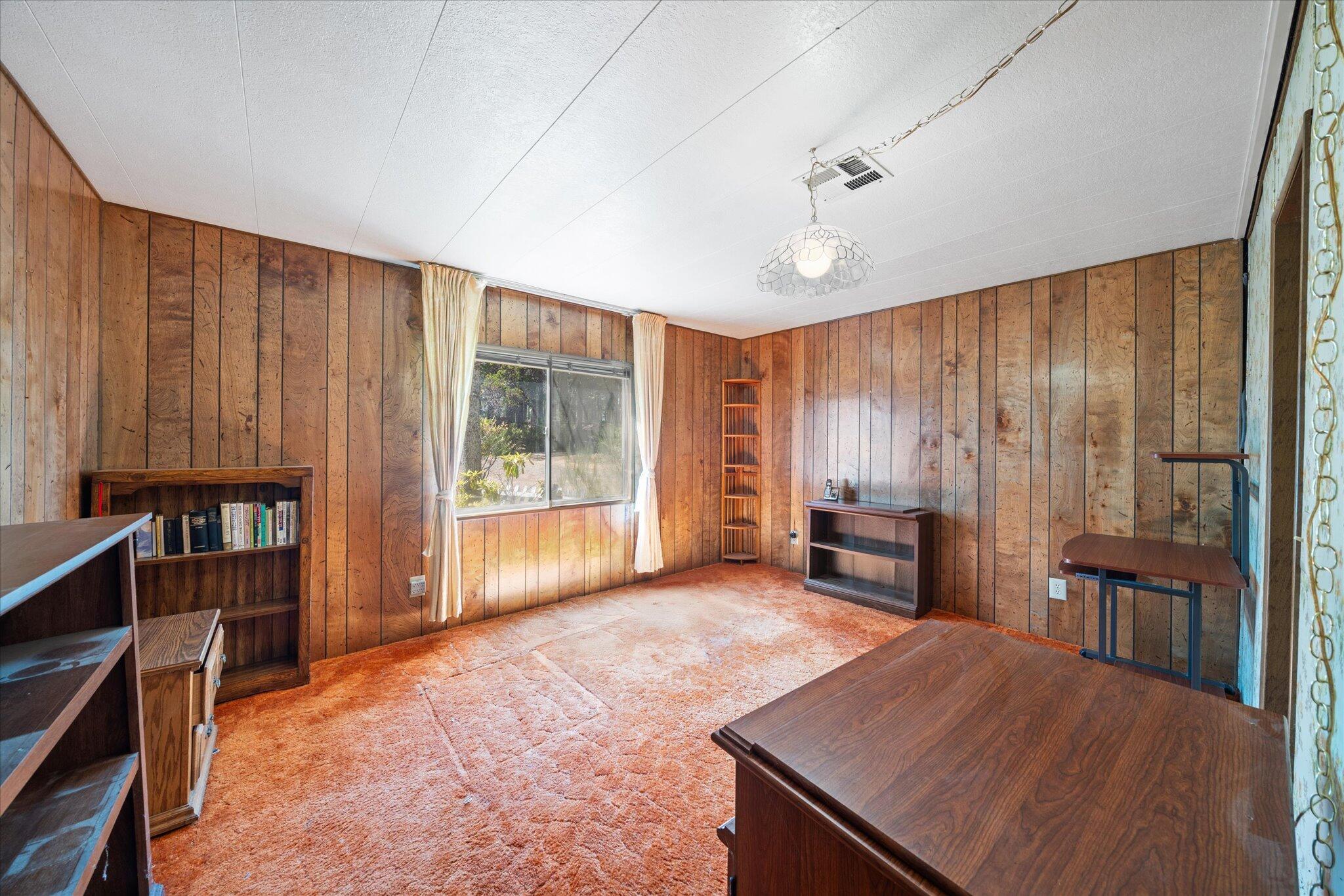 30588 Shingletown Ridge Road Shingletown, CA 96088 - Photo 21 of 44 wooden floor in an empty room with a window