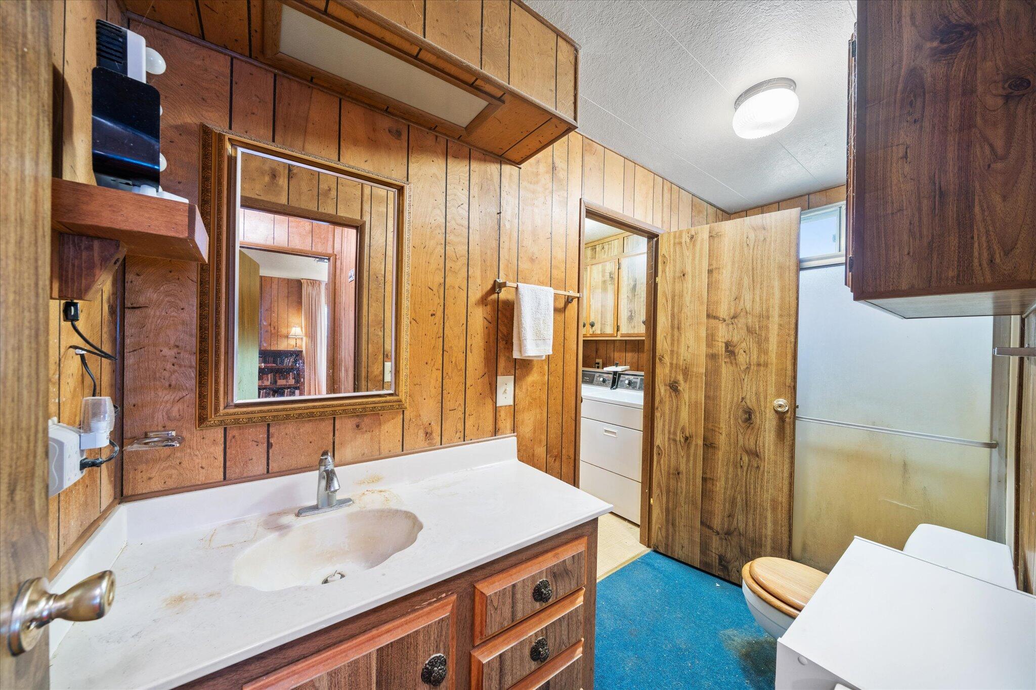30588 Shingletown Ridge Road Shingletown, CA 96088 - Photo 26 of 44 a bathroom with a sink a toilet and shower