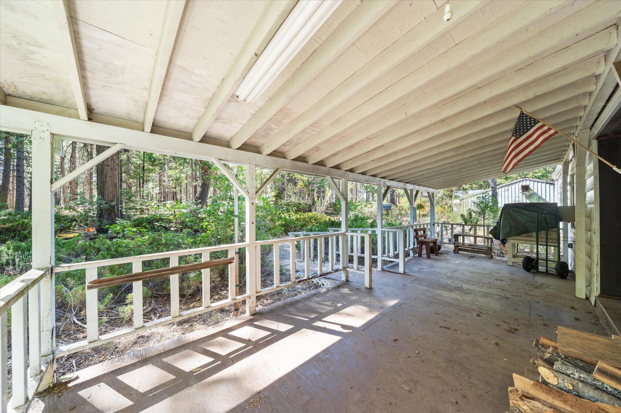 30588 Shingletown Ridge Road Shingletown, CA 96088 - Photo 33 of 44 a view of a porch with chairs and backyard