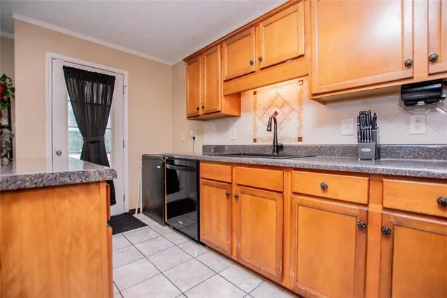 a spacious bedroom with a bed and a chandelier