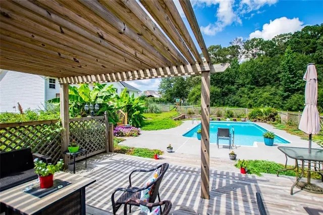 a living room with furniture and a rug