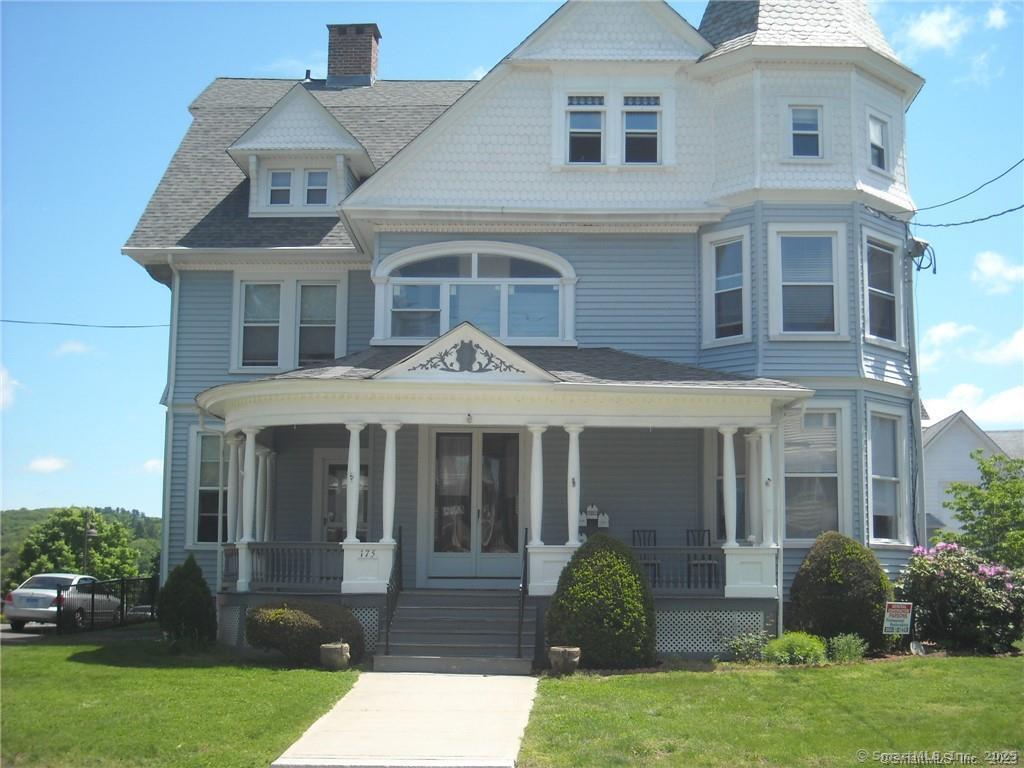 175 Minerva Street, Unit 1B Derby, CT 06418 - Photo 1 of 1 front view of a house with a yard