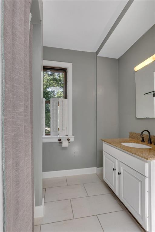 9615 Harding Road Pittsburgh, PA 15237 - Photo 21 of 25 a spacious bathroom with a granite countertop sink a mirror and a bathtub
