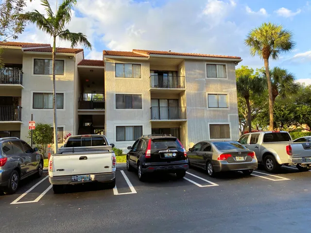 a view of a cars parked in front of a building