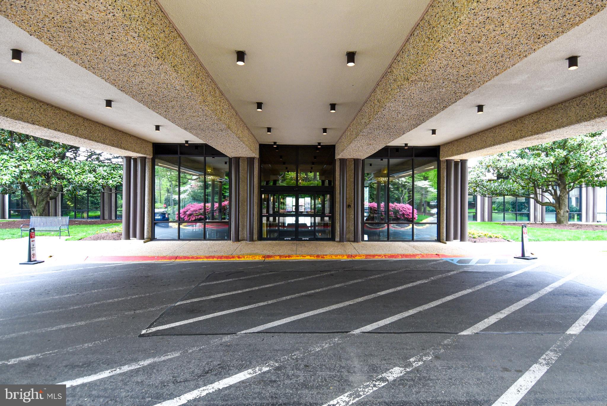 5225 Pooks Hill Road, Unit 803N Bethesda, MD 20814 - Photo 24 of 43 a view of a patio with a swimming pool table and chairs