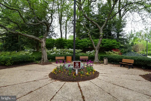 a view of a garden with sitting area