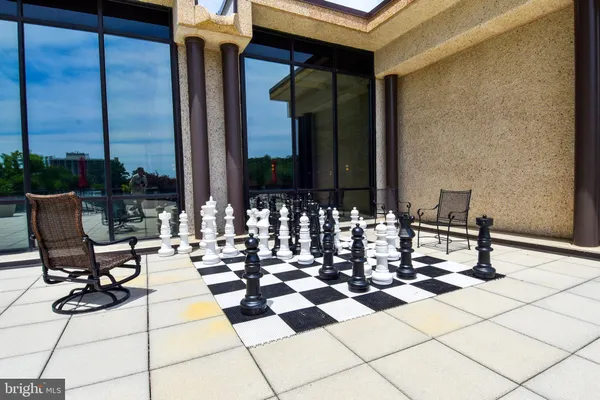 a view of balcony with chairs and tables