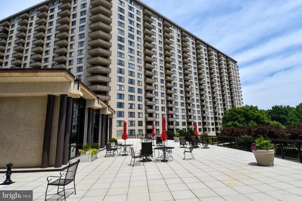 a view of building with sitting area