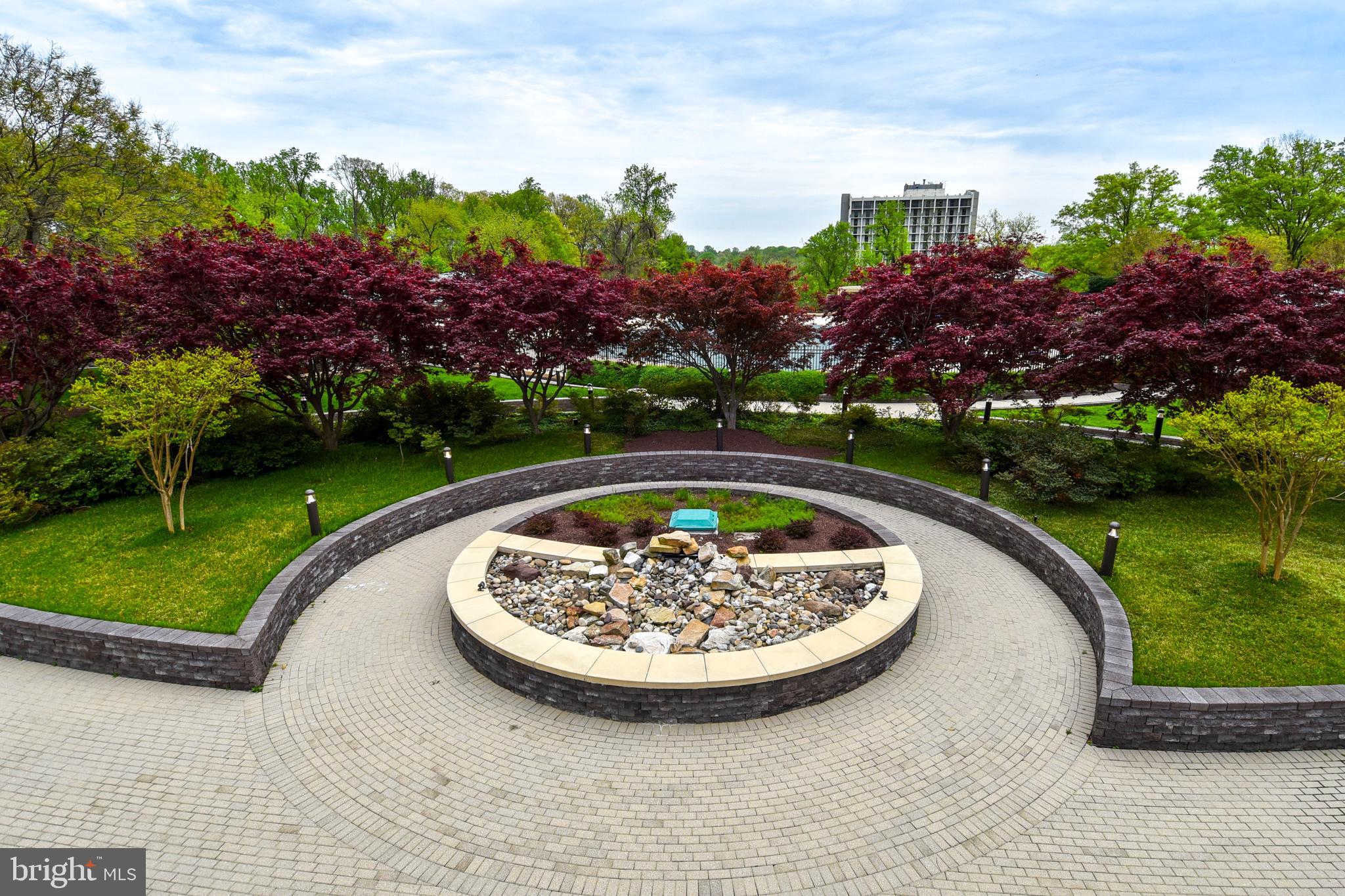 5225 Pooks Hill Road, Unit 803N Bethesda, MD 20814 - Photo 32 of 43 a view of a swimming pool with a garden