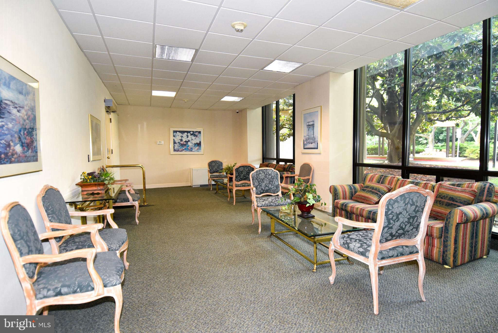 5225 Pooks Hill Road, Unit 803N Bethesda, MD 20814 - Photo 34 of 43 a living room with furniture and a large window