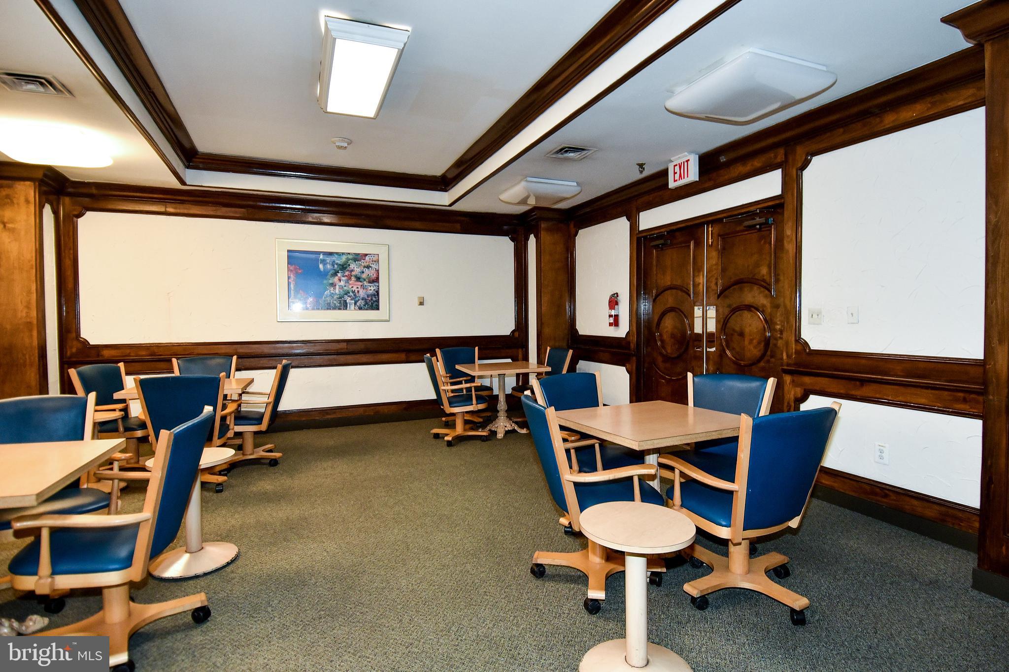 5225 Pooks Hill Road, Unit 803N Bethesda, MD 20814 - Photo 36 of 43 a room with gym equipment and windows