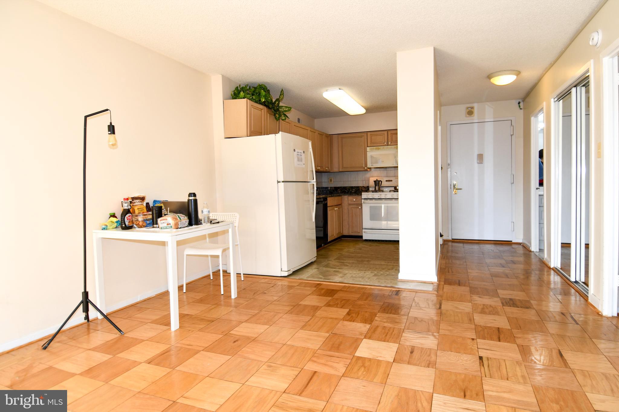 5225 Pooks Hill Road, Unit 803N Bethesda, MD 20814 - Photo 10 of 43 a view of kitchen with furniture and refrigerator