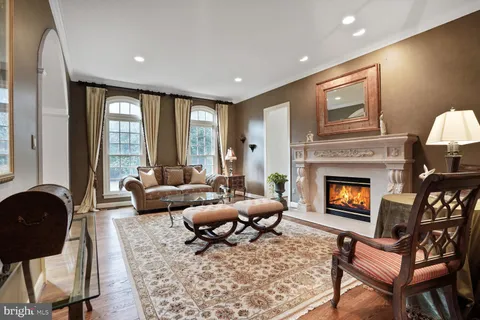 a living room with furniture and a lamp