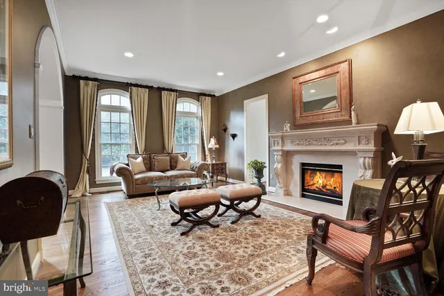 a living room with furniture and a lamp