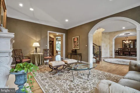 a living room filled with furniture and a large window