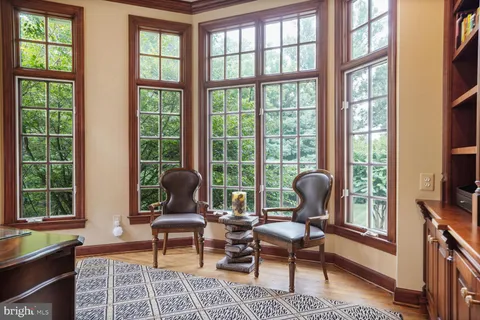 a bathroom with a granite countertop sink toilet and mirror