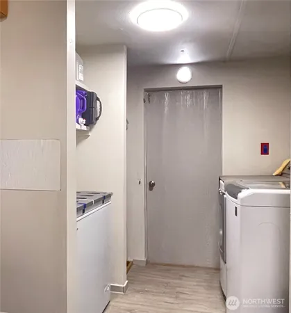a view of hallway with washer and dryer