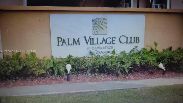a sign of golf club on a wall under a wall
