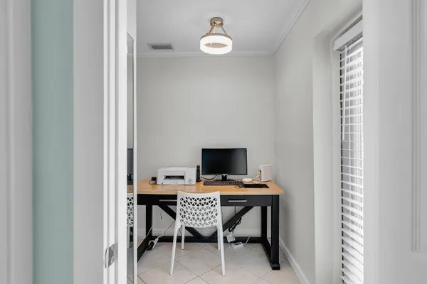 a workspace with furniture and a window
