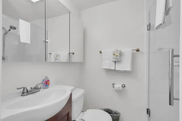 a bathroom with a sink toilet and vanity
