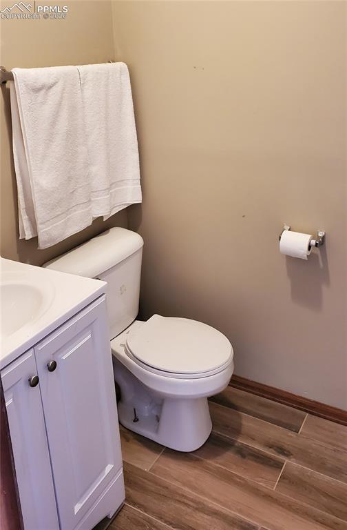 400 Victor Avenue Victor, CO 80860 - Photo 22 of 36 a white toilet sitting next to a white cabinet