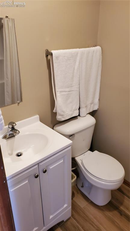 400 Victor Avenue Victor, CO 80860 - Photo 26 of 36 a white toilet sitting next to a bathroom sink