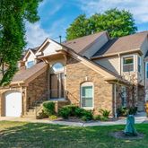 a view of house with yard