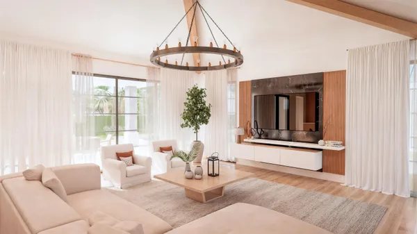 a living room with furniture a window and a table