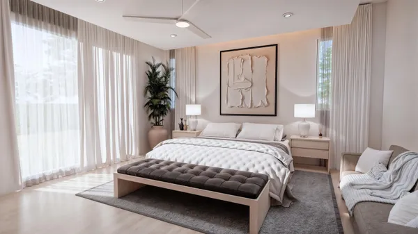 a bedroom with a large bed and a window