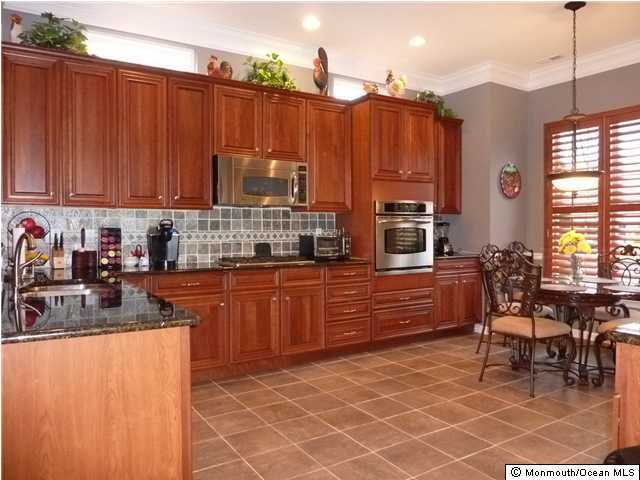 11 Muirfield Road Jackson, NJ 08527 - Photo 3 of 3 a kitchen with stainless steel appliances a stove a sink and a refrigerator