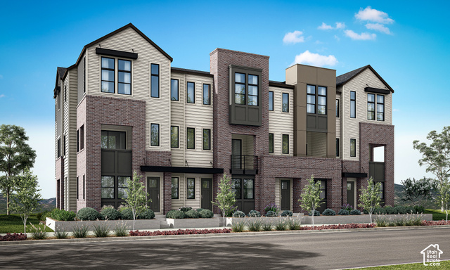 4954 Rodeo Walk Drive, Unit 39 Holladay, UT 84117 - Photo 1 of 1 Modern multi-story facade featuring brick and siding accents, multiple windows, and a dark-toned roof