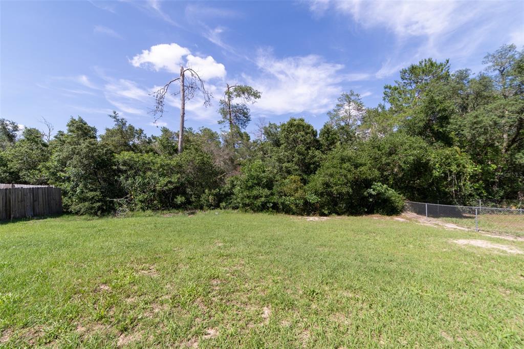 5107 Southwest 165th St Road Ocala, FL 34473 - Photo 34 of 34 a view of an outdoor space and a yard