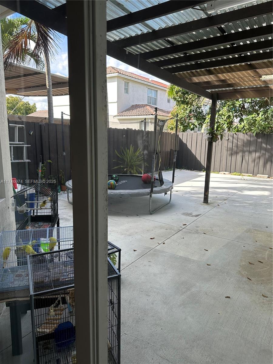 11031 Southwest 246th Street Homestead, FL 33032 - Photo 13 of 25 a view of yard with patio