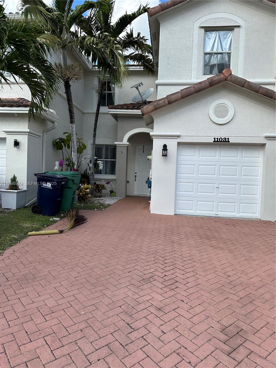 11031 Southwest 246th Street Homestead, FL 33032 - Photo 2 of 25 a view of a house with a patio