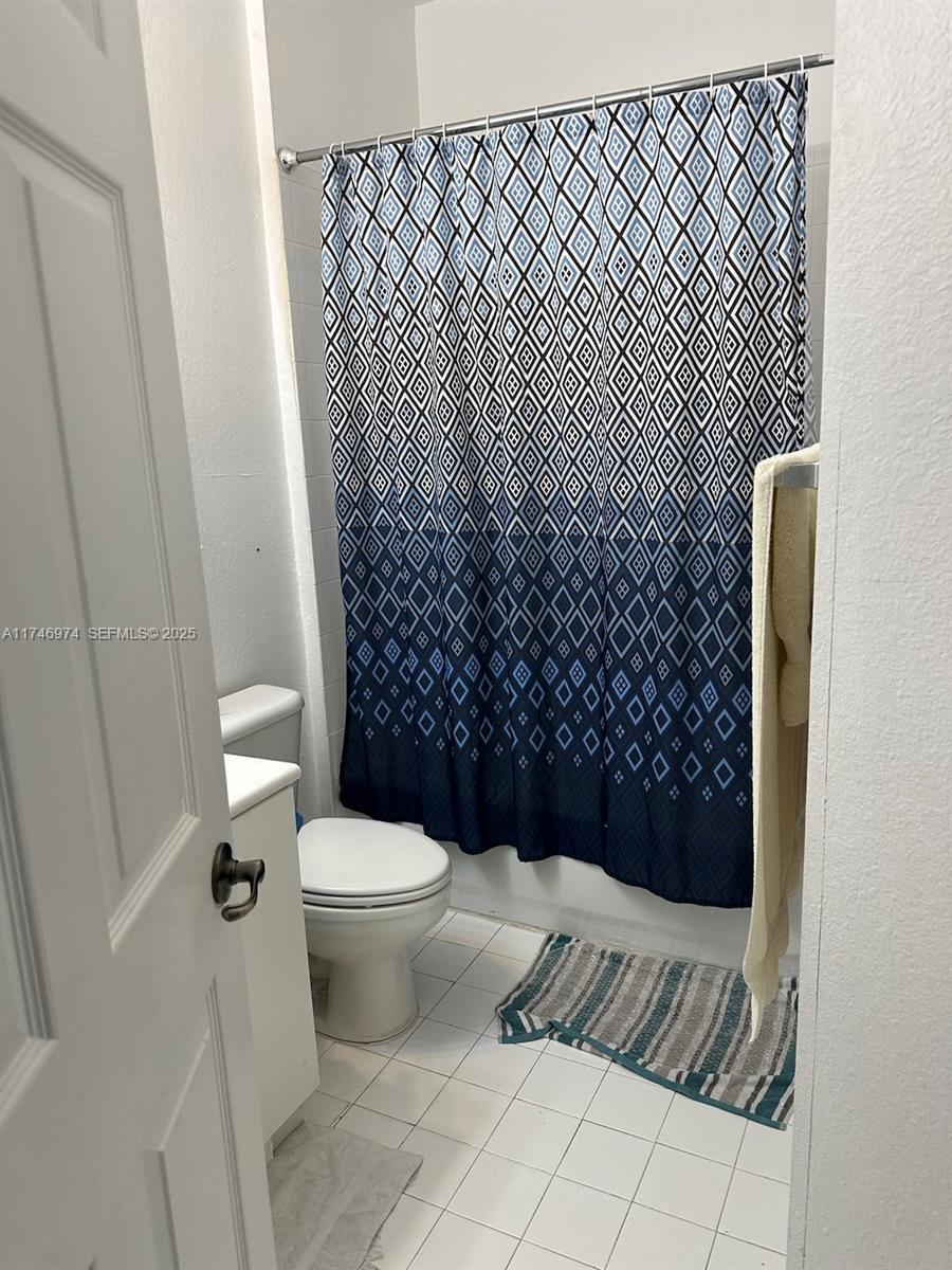 11031 Southwest 246th Street Homestead, FL 33032 - Photo 24 of 25 a bathroom with a toilet and a shower