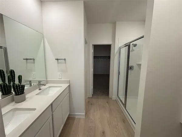 a bathroom with a sink a mirror and a toilet