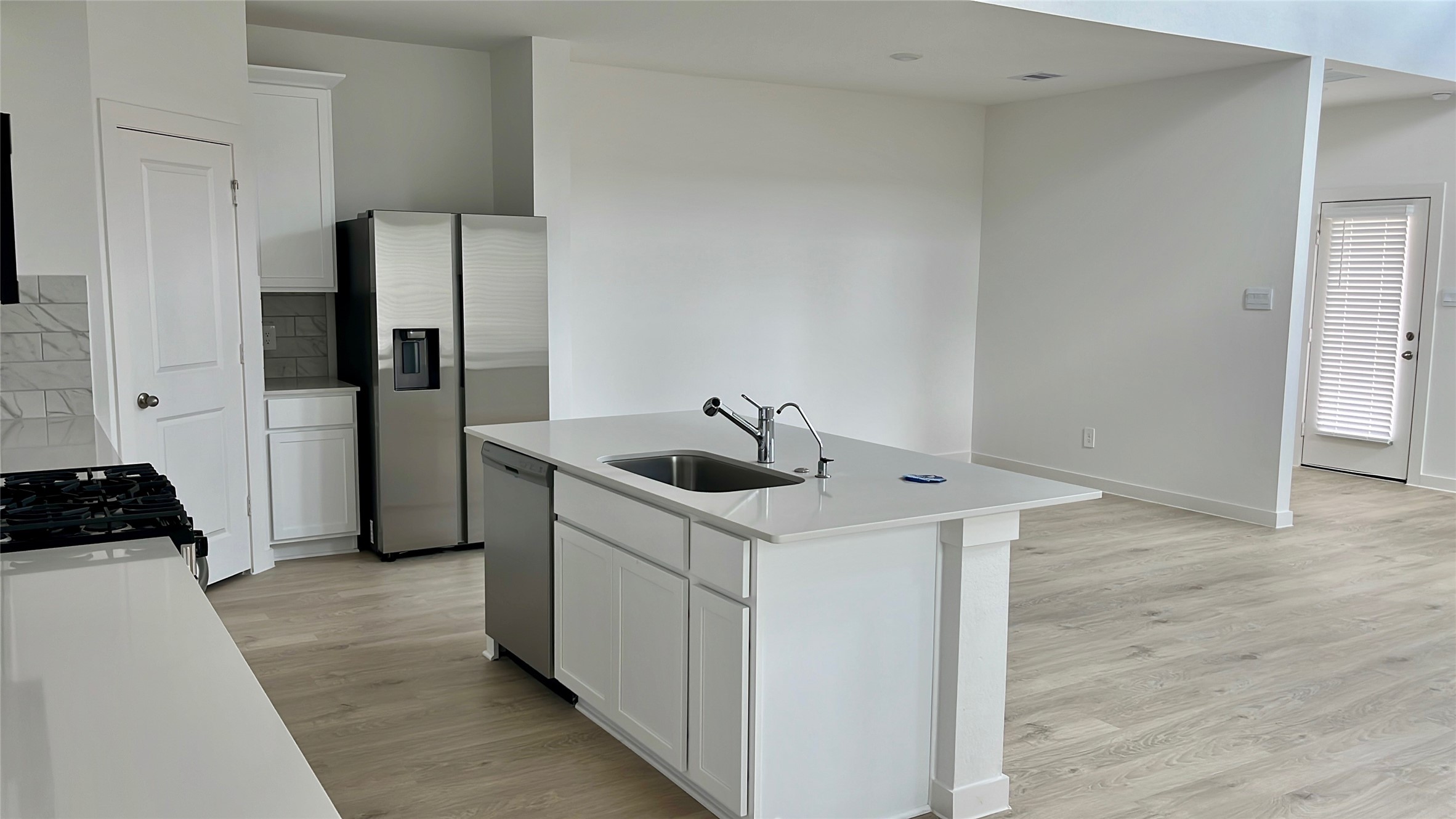 4315 Windsor Forest Fulshear, TX 77494 - Photo 20 of 50 Open Concept! Kitchen with Island and a newly installed refrigerator!