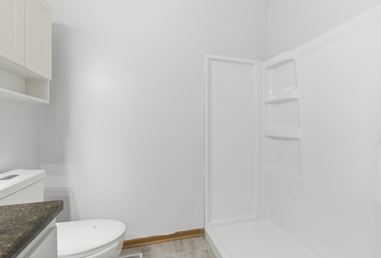 660 West 1st Street Braidwood, IL 60408 - Photo 13 of 19 a white toilet sitting next to a bath tub