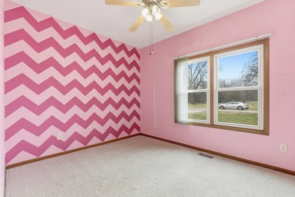 a view of a bedroom with windows