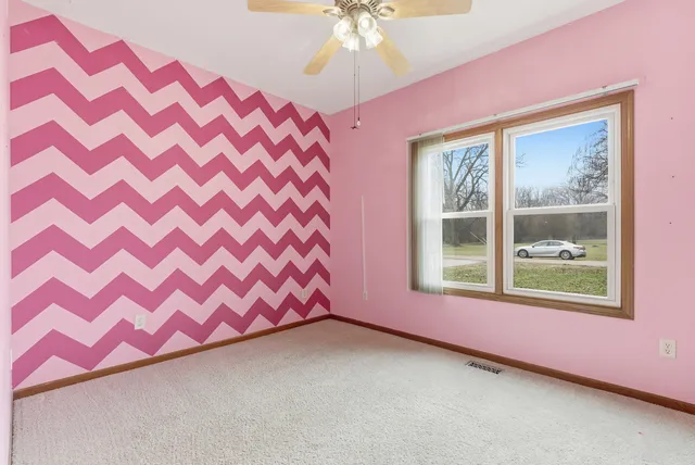a view of a bedroom with windows