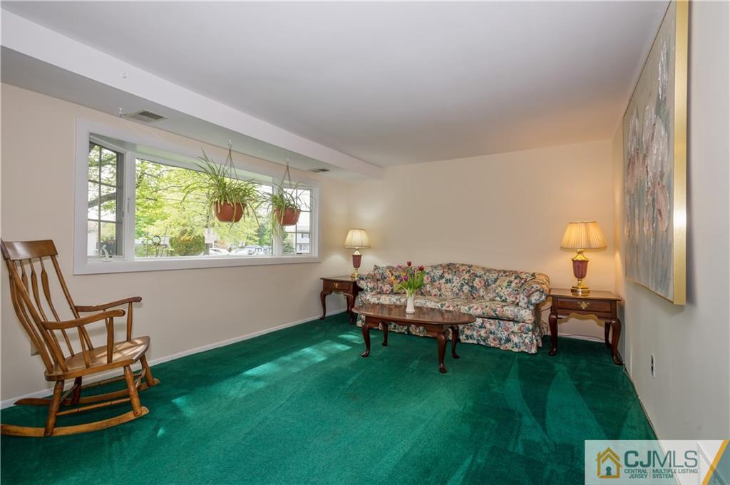 6 Paley Place Edison, NJ 08817 - Photo 2 of 18 a bed room with a bed and a chair