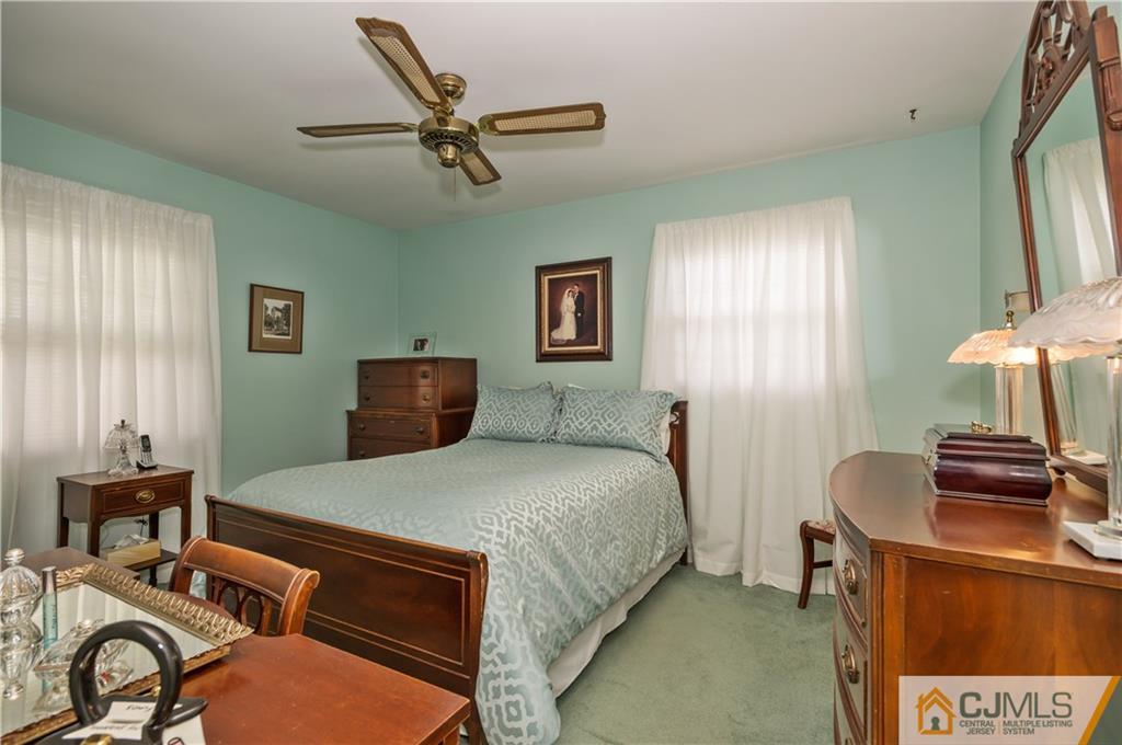 6 Paley Place Edison, NJ 08817 - Photo 13 of 18 a bedroom with a bed and a dresser