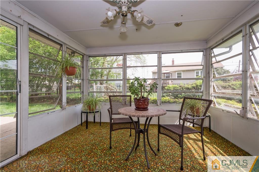 6 Paley Place Edison, NJ 08817 - Photo 14 of 18 a view of a dining room with furniture large windows and wooden floor