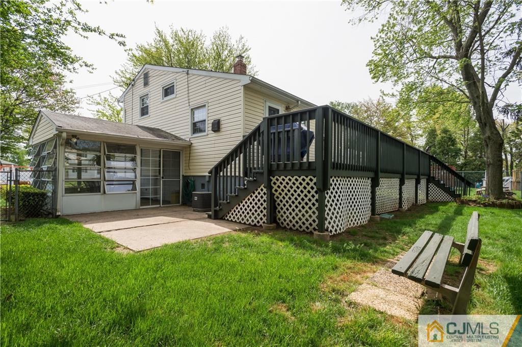 6 Paley Place Edison, NJ 08817 - Photo 17 of 18 a view of a house with a yard and deck