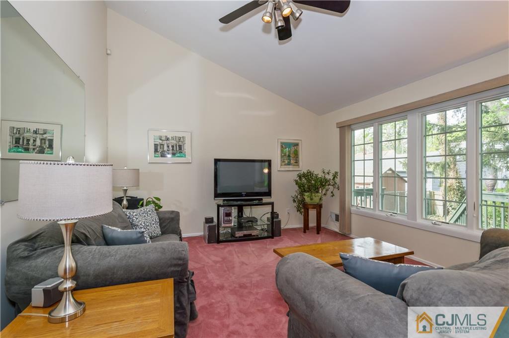 6 Paley Place Edison, NJ 08817 - Photo 4 of 18 a living room with furniture and a flat screen tv